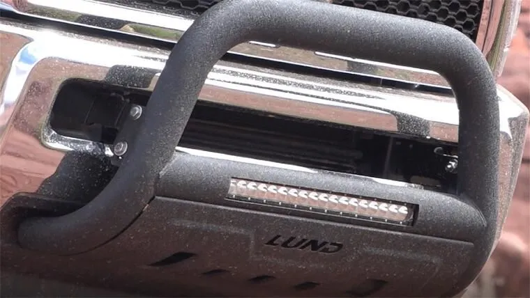 Lund 47121207 - 3.5" Black Steel Bull Bar with Integrated LED Light Bar and with skid plate for Ford F-250 11-16