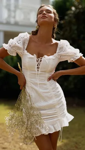 White Eyelet Lace Puff Sleeve Mini Dress Lace Up Square Scoop Neck Ruffle Hem Double Drawstrings For A Perfect Fit Available In Sizes Small Medium Large Or XL